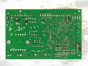 bottom side of PCB after desoldering all the components off the printed circuit board which going to be reverse engineered
